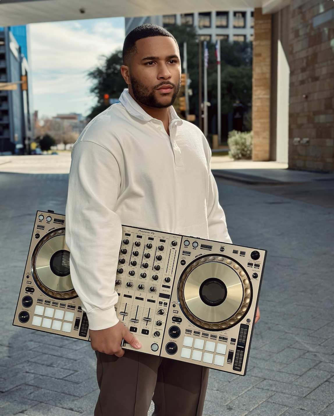DJ Lil Kev with headphones and controller